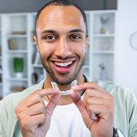 Patient at dental office front desk paying for Clear Aligners