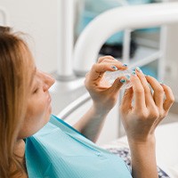 Woman undergoing routine check-in with clear aligners