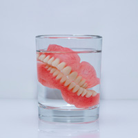 Dentures in a glass of water
