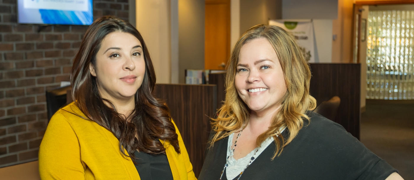 2 women posting at dental office