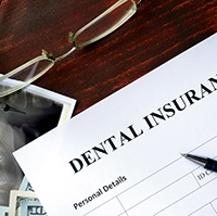 Dental insurance paperwork and digital X-rays