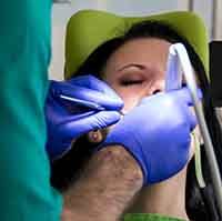 Female patient in the dentist’s chair under oral conscious sedation