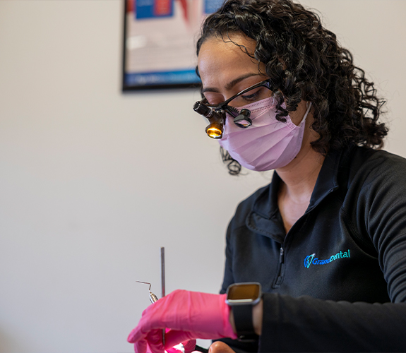 woman smiling during dental cleaning