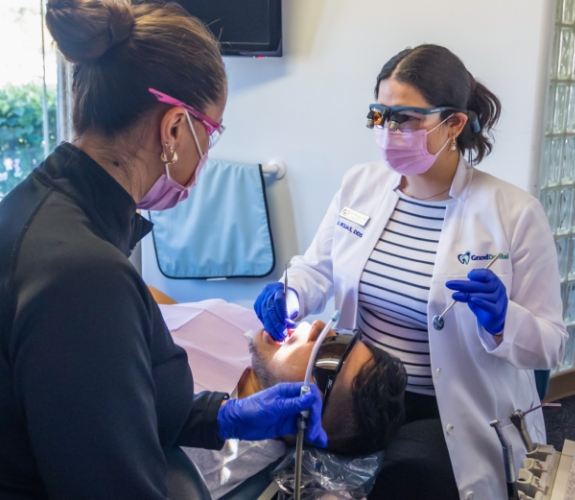 woman smiling during dental cleaning