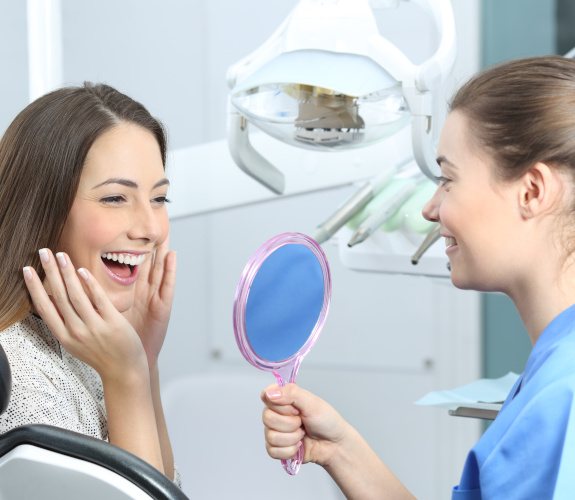 Female patient pleased with straighter teeth